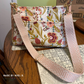 Crossbody bag in cream floral print with a rose and beige jacquard webbing strap