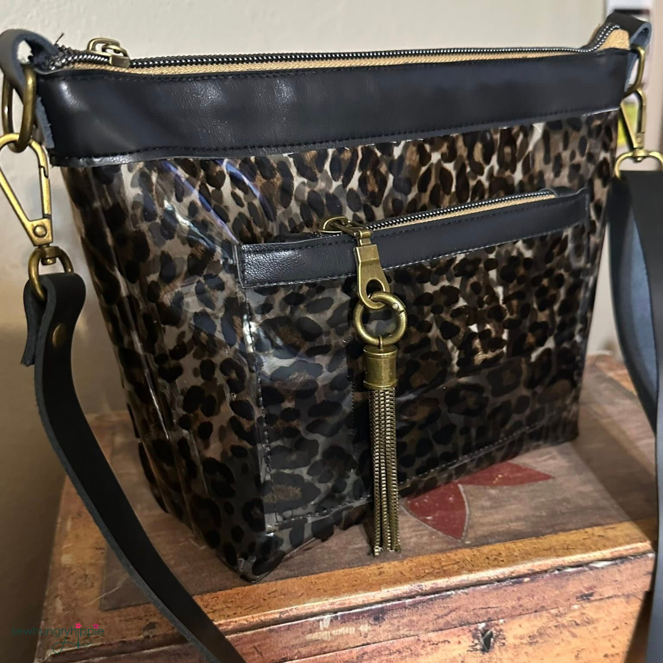 stylish clear classic black bag made with leopard print vinyl gold zipper and tassel
