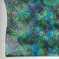 Teal and blue embossed serpent vinyl with a scale texture and gold foil accents. This shimmering faux leather is perfect for high-end bag making.