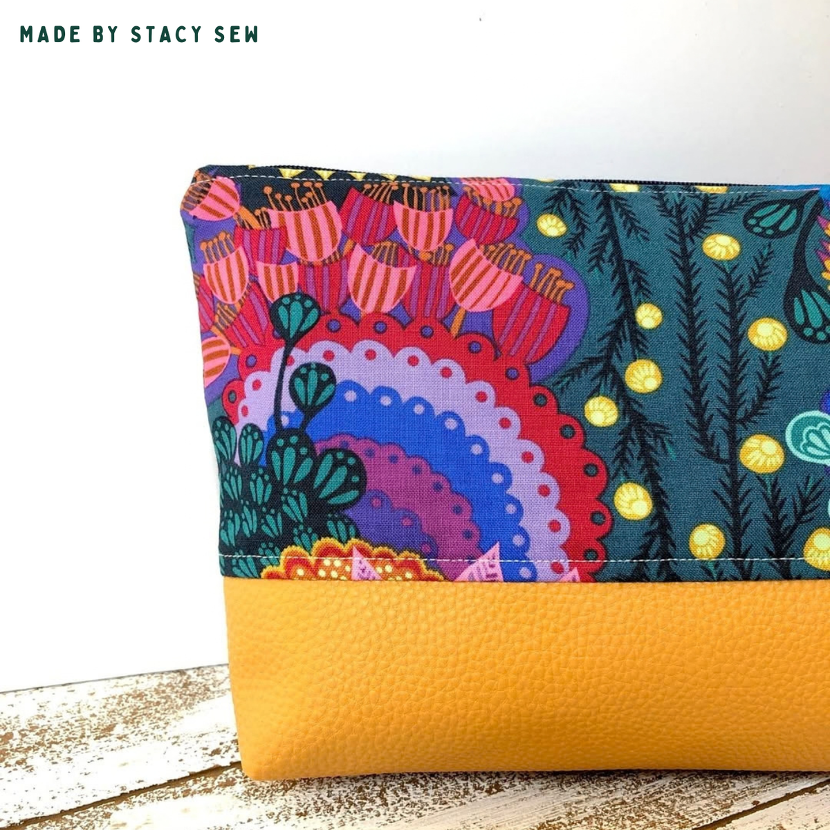 Close-up of bag in bold folk floral print with mustard Moonglow vinyl base