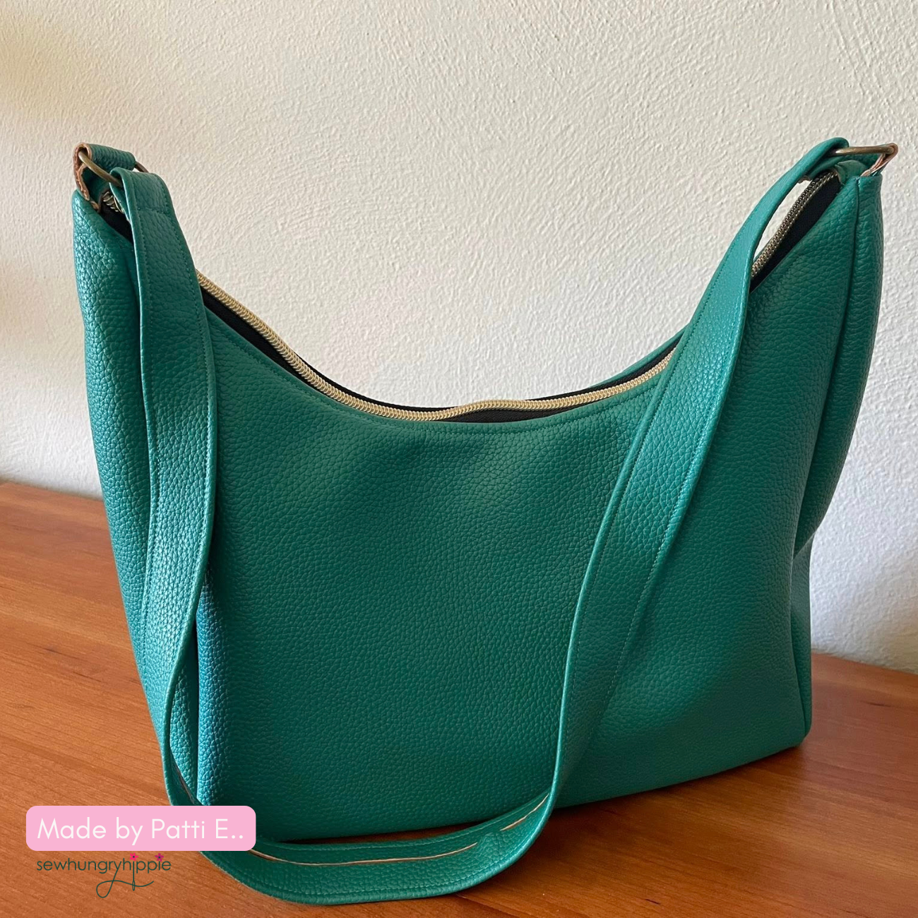 Teal pebbled leather-look slouchy shoulder bag with gold hardware.