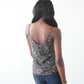 Woman wearing a tank top with a geometric pattern on a white background