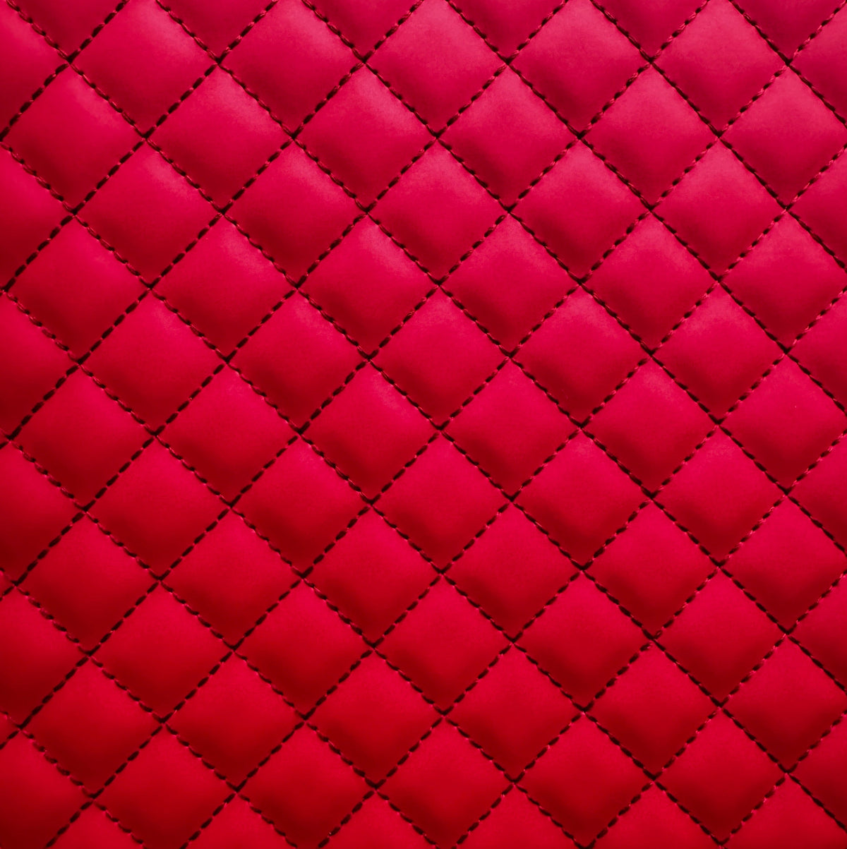 Red quilted fabric with diamond pattern