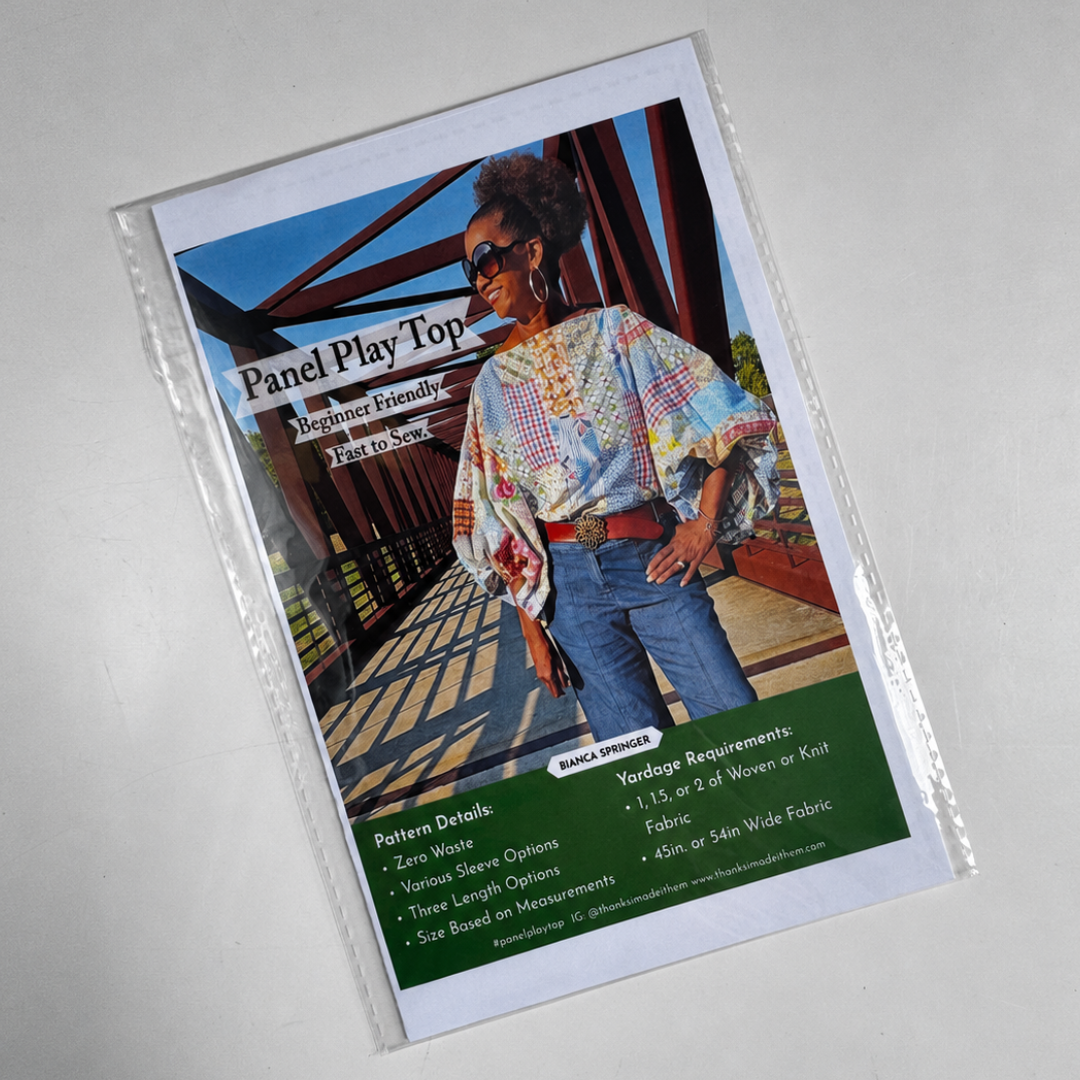 Sewing pattern flyer on textured table