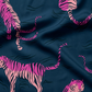 Close-up of Ruby Star Society Tiger Print Fabric on Navy Blue Cotton.