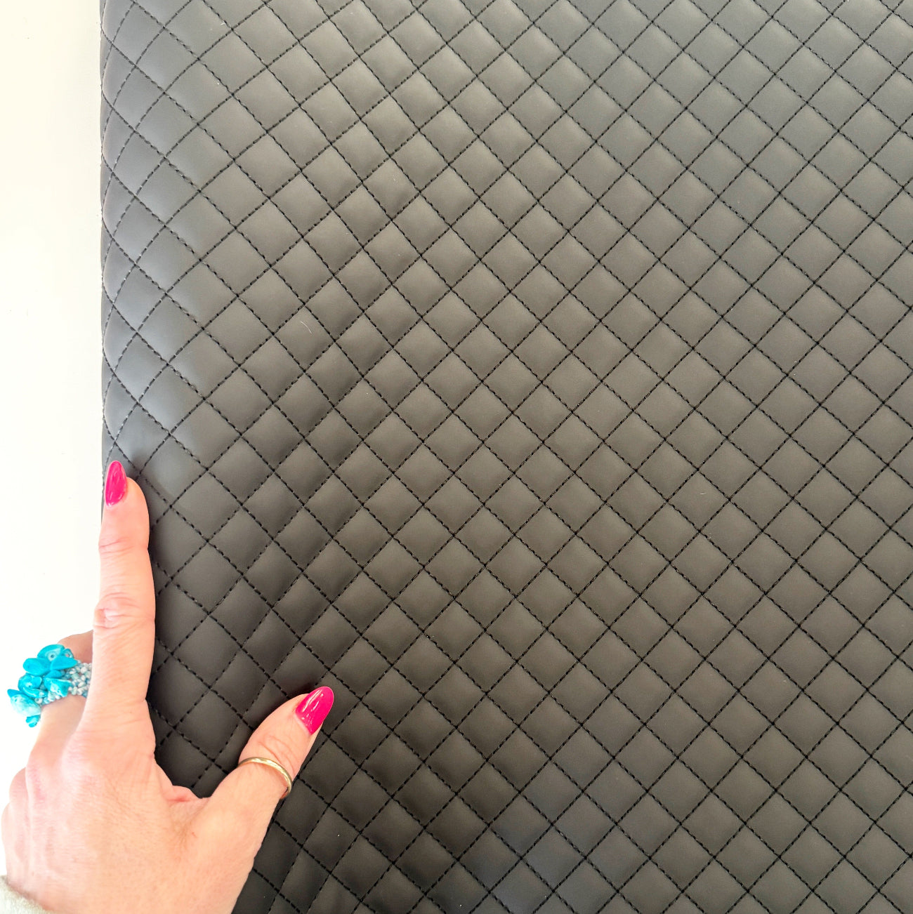 Black diamond quilted vinyl material for sewing handbags, backpacks, and accessories
