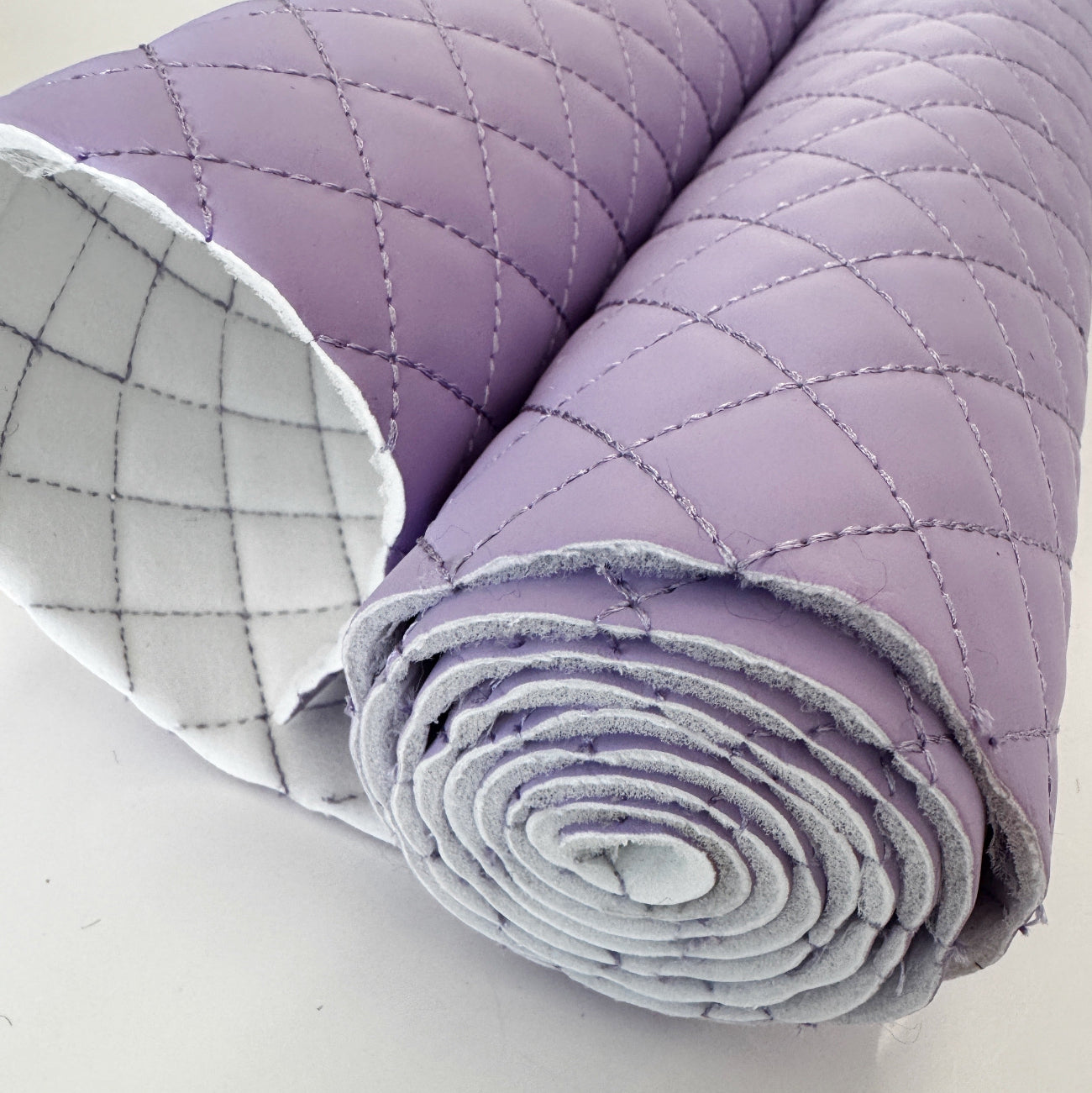 Lavender quilted vinyl material with padded texture for handbags, purses, and accessories
