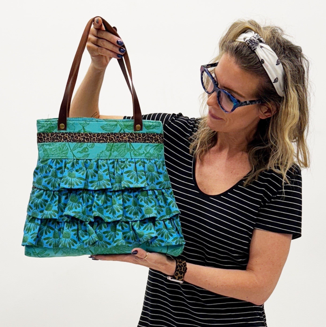 Woman holding Rosetta bag for DIY sewing pattern