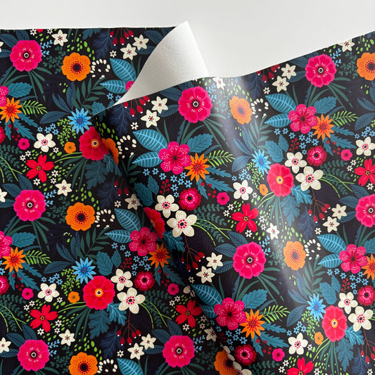 Colorful floral patterned paper with a dark background