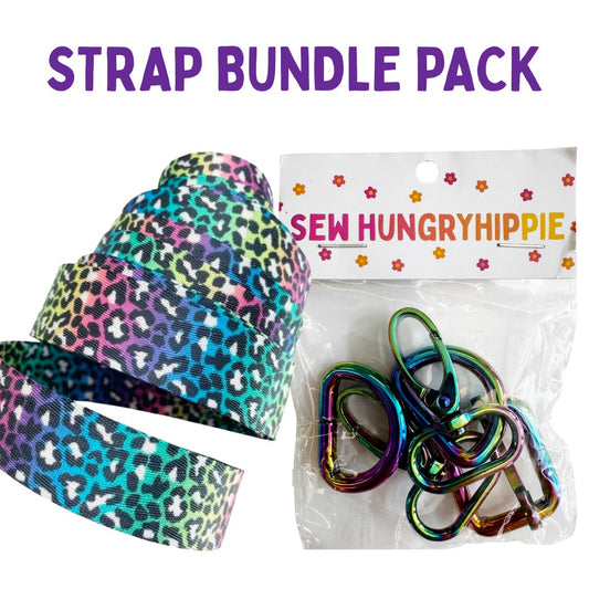 A craft accessory bundle pack featuring a roll of leopard print elastic ribbon in multiple colors and a clear bag of iridescent metal carabiners, with purple text reading 'STRAP BUNDLE PACK' at the top.