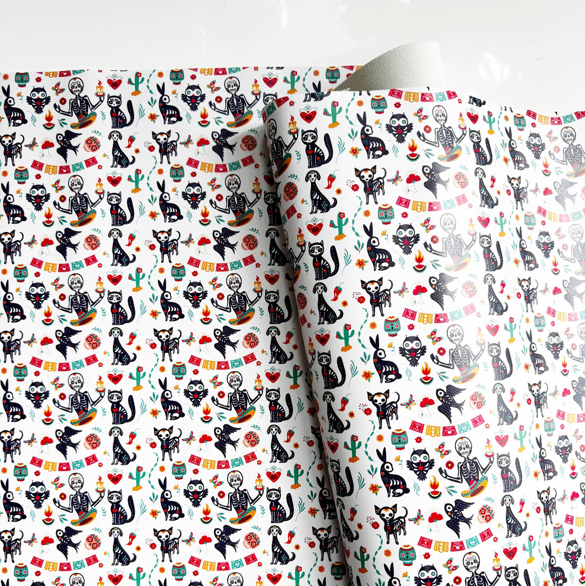 Fiesta Sugar Skulls Printed Vinyl Fabric from Sew Hungryhippie, featuring a festive Day of the Dead (Día de los Muertos) pattern with skeletal figures and animals.