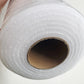 Roll of white foam stabilizer interfacing on white background