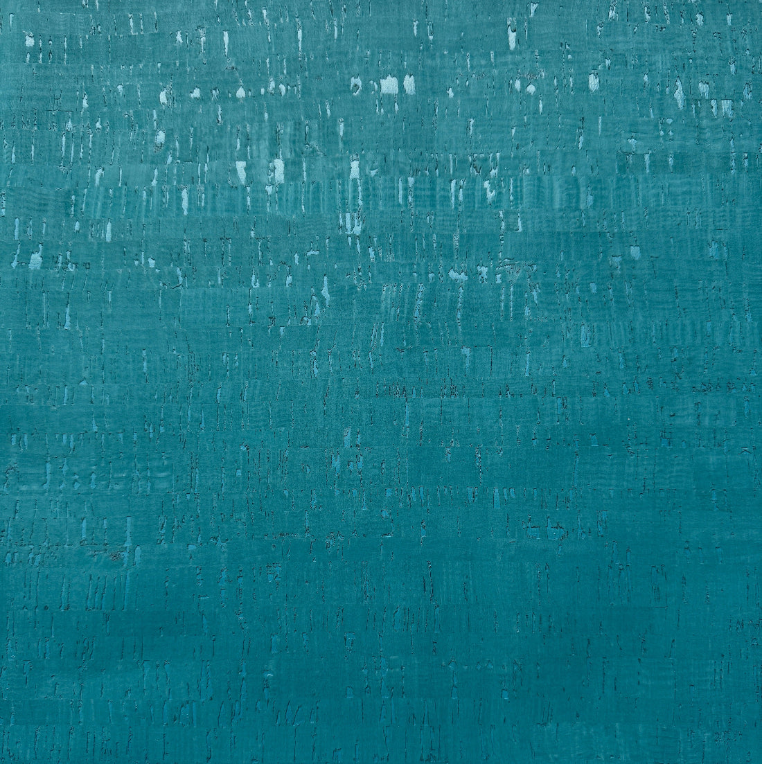A close-up of a textured teal fabric with subtle horizontal and vertical brush-like striations and small white speckles.