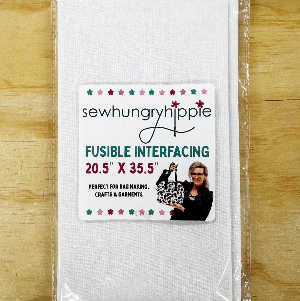 Packaged fusible interfacing with 'sewhungryhippie' branding on a wooden surface