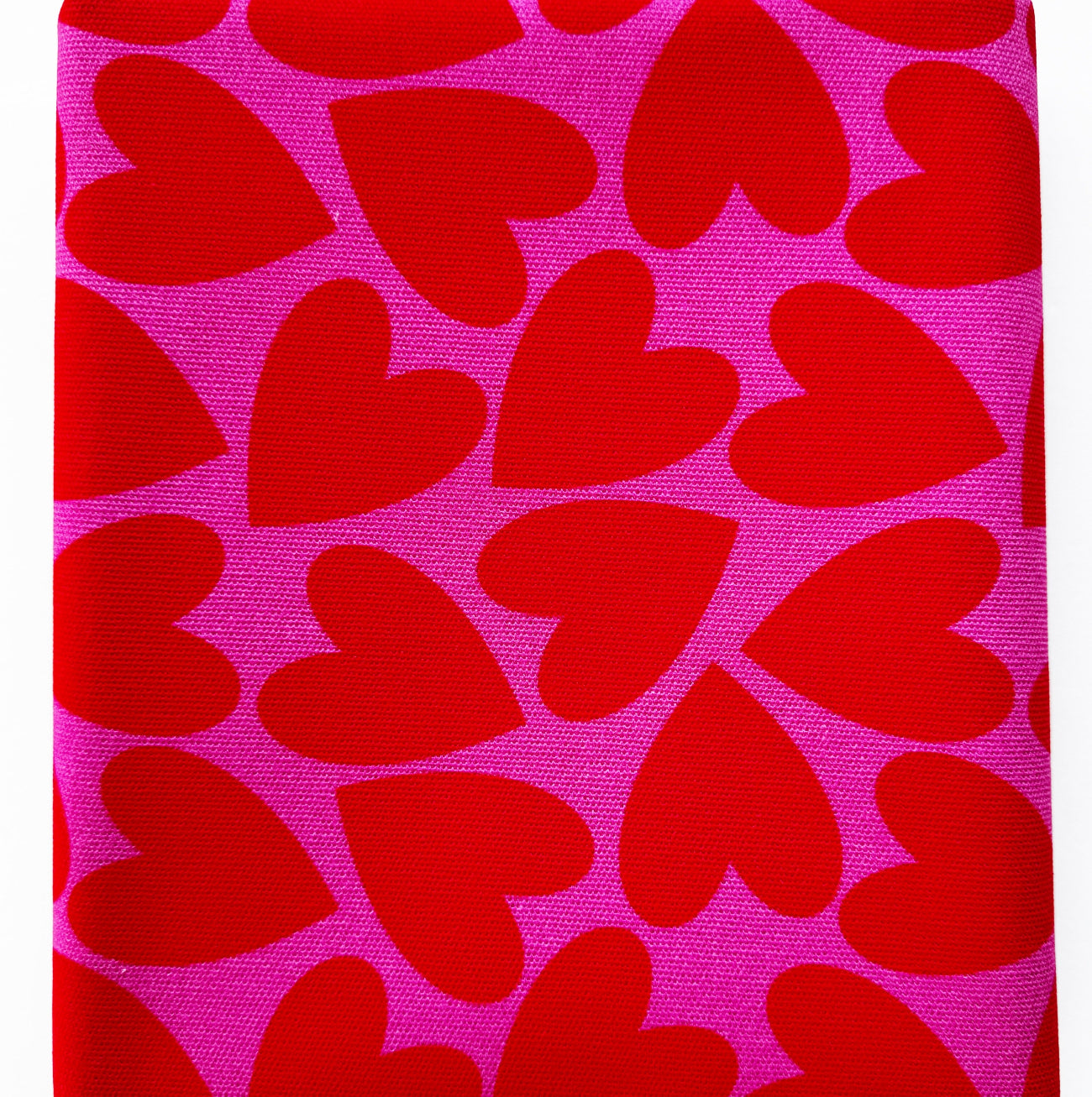 Seamless vibrant red hearts on a hot pink background canvas fabric
