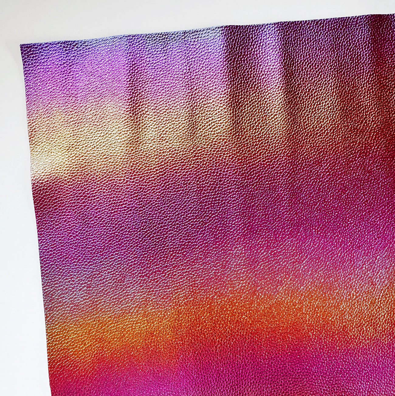 rainbow iridescent textured faux leather vinyl with color shift finish for bag making and sewing projects
