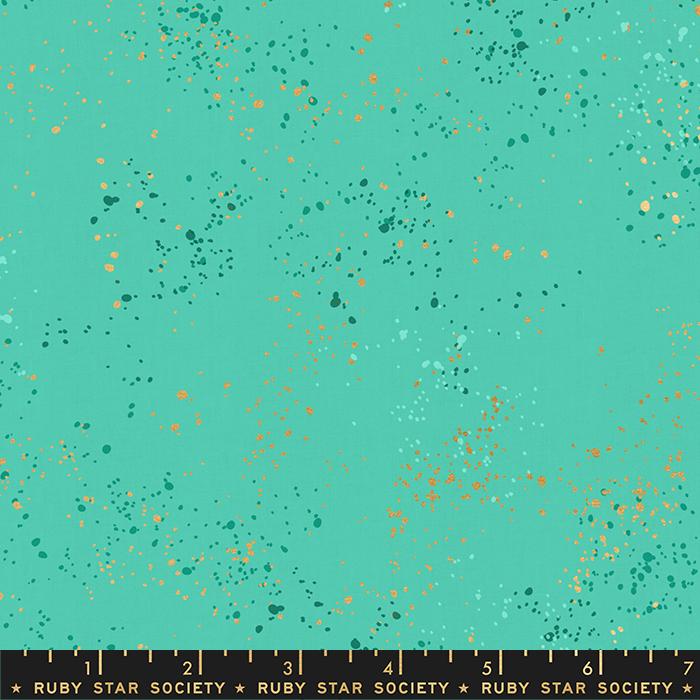 Speckled Metallic Icebox Cotton Fabric by Ruby Star Society, featuring a vibrant turquoise-teal background covered in metallic copper-gold and dark teal paint-splatter flecks.