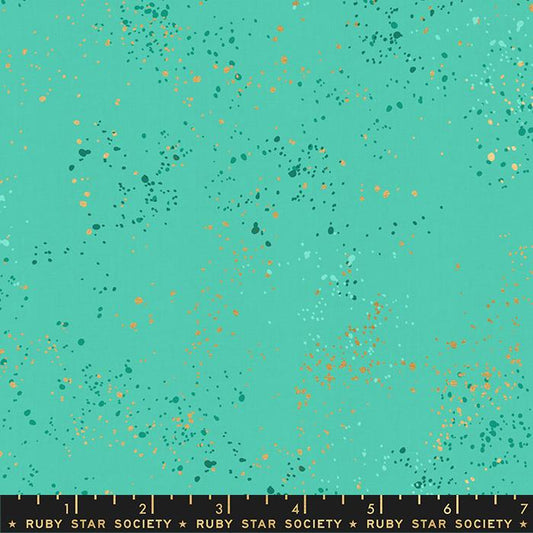 Speckled Metallic Icebox Cotton Fabric by Ruby Star Society, featuring a vibrant turquoise-teal background covered in metallic copper-gold and dark teal paint-splatter flecks.