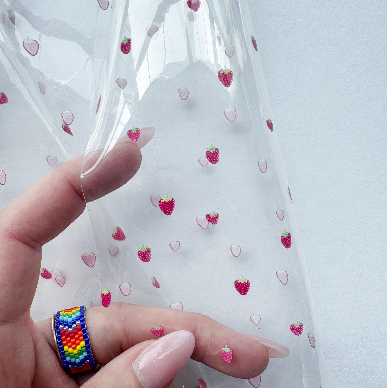 Clear printed TPU vinyl with small strawberry pattern for pouches and accessories
