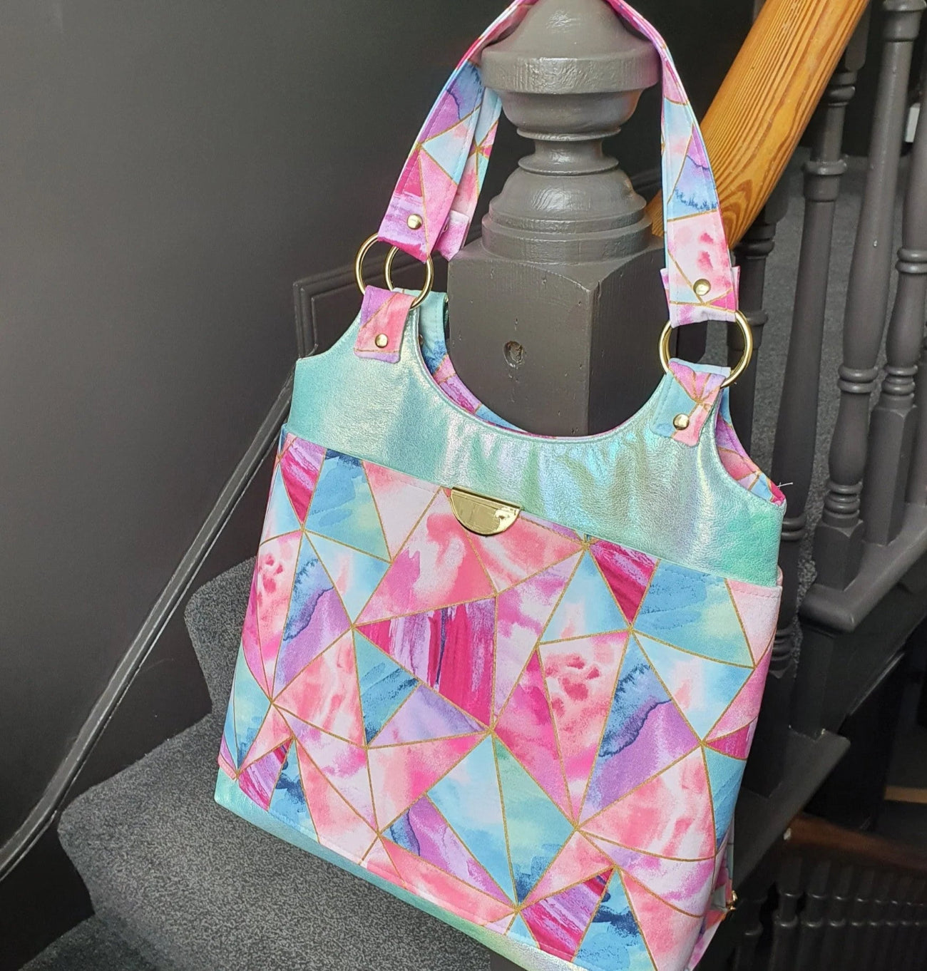 Studio Backpack sewing pattern digital PDF featuring modern backpack design with multiple pockets, zipper closure, and adjustable straps for bag making projects.
