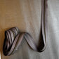Strawberry Mocha #5 continuous zipper tape with bronze teeth paired with Taupe Moonglow vinyl. A coordinating combination for handmade handbags, wallets, backpacks, pouches, and other bag-making projects.