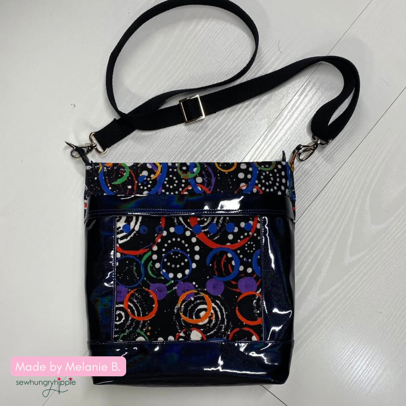DIY handmade Aspen Crossbody Bag in shiny vinyl and colorful fabric with stylish crossbody purse design for sewing inspiration.