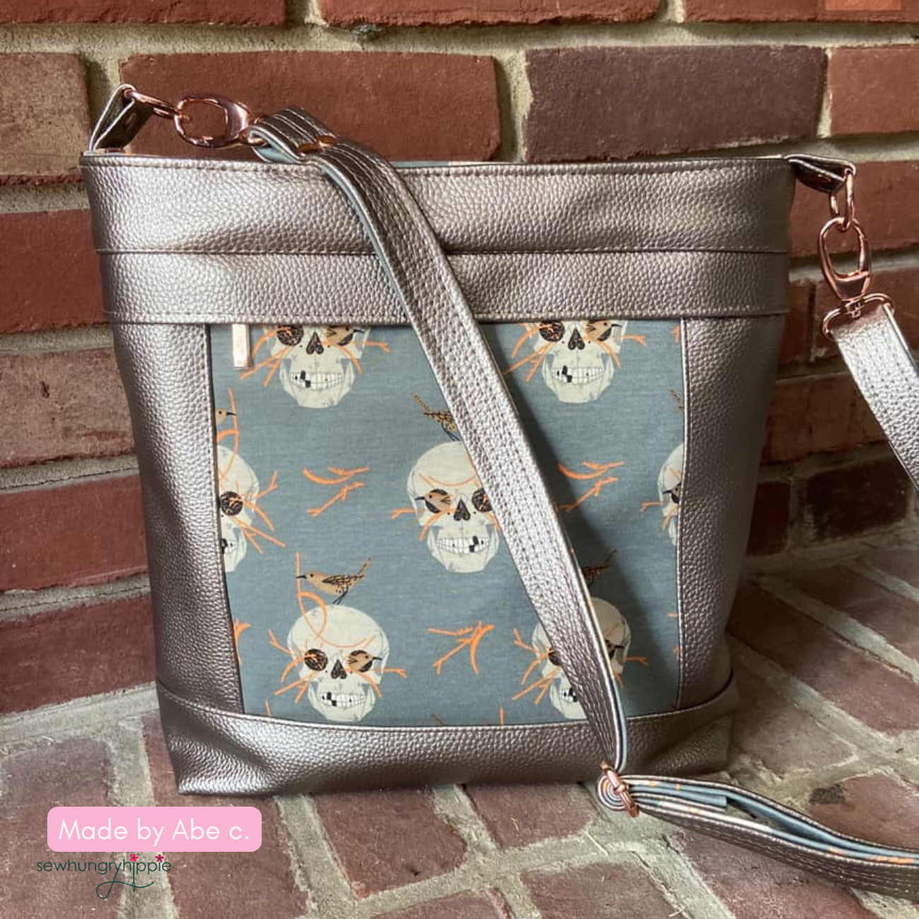 Handmade Aspen Crossbody Bag crafted with taupe moonglow vinyl exterior and skull fabric design for a modern DIY bag project.