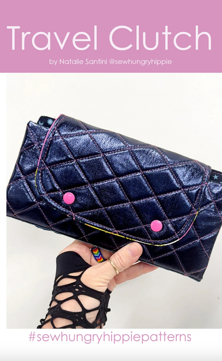 Navy quilted travel clutch held by a hand with a white background, featuring the brand 'sewhungryhippie'.