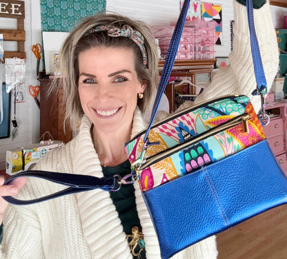 Woman holding blue handbag a_a8024d4d-dd7e