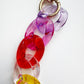 Colorful keychain with heart-shaped links on a white background