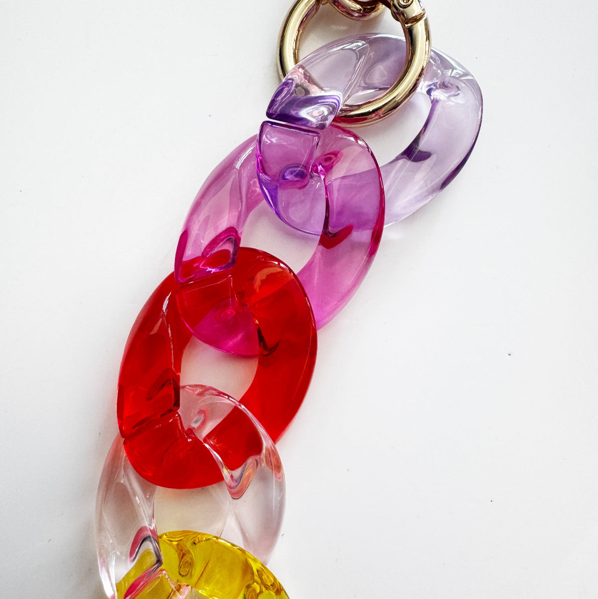 Colorful keychain with heart-shaped links on a white background