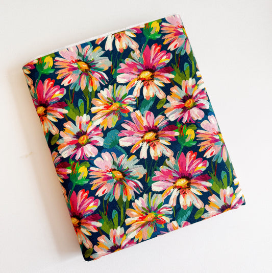 Floral-patterned fabric with colorful flowers on a blue background