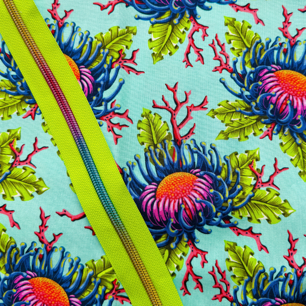 Aqua sea anemone floral cotton fabric paired with a lime green zipper for sewing projects