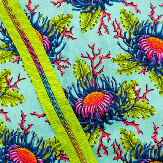 Aqua sea anemone floral cotton fabric paired with a lime green zipper for sewing projects