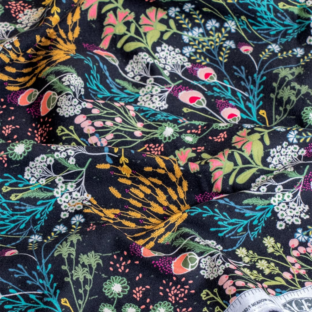 Meadow Umbra cotton flannel, a folk floral on a dark background