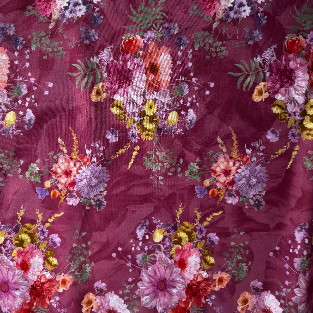 Floral pattern with various flowers on a red background