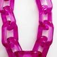 Close-up of a pink chain on a white background