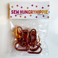 A clear plastic bag containing several metallic rose gold sewing clips, sealed with a white paper header card printed with the brand name 'SEW HUNGRYHIPPIE' in colorful letters and small flower illustrations.
