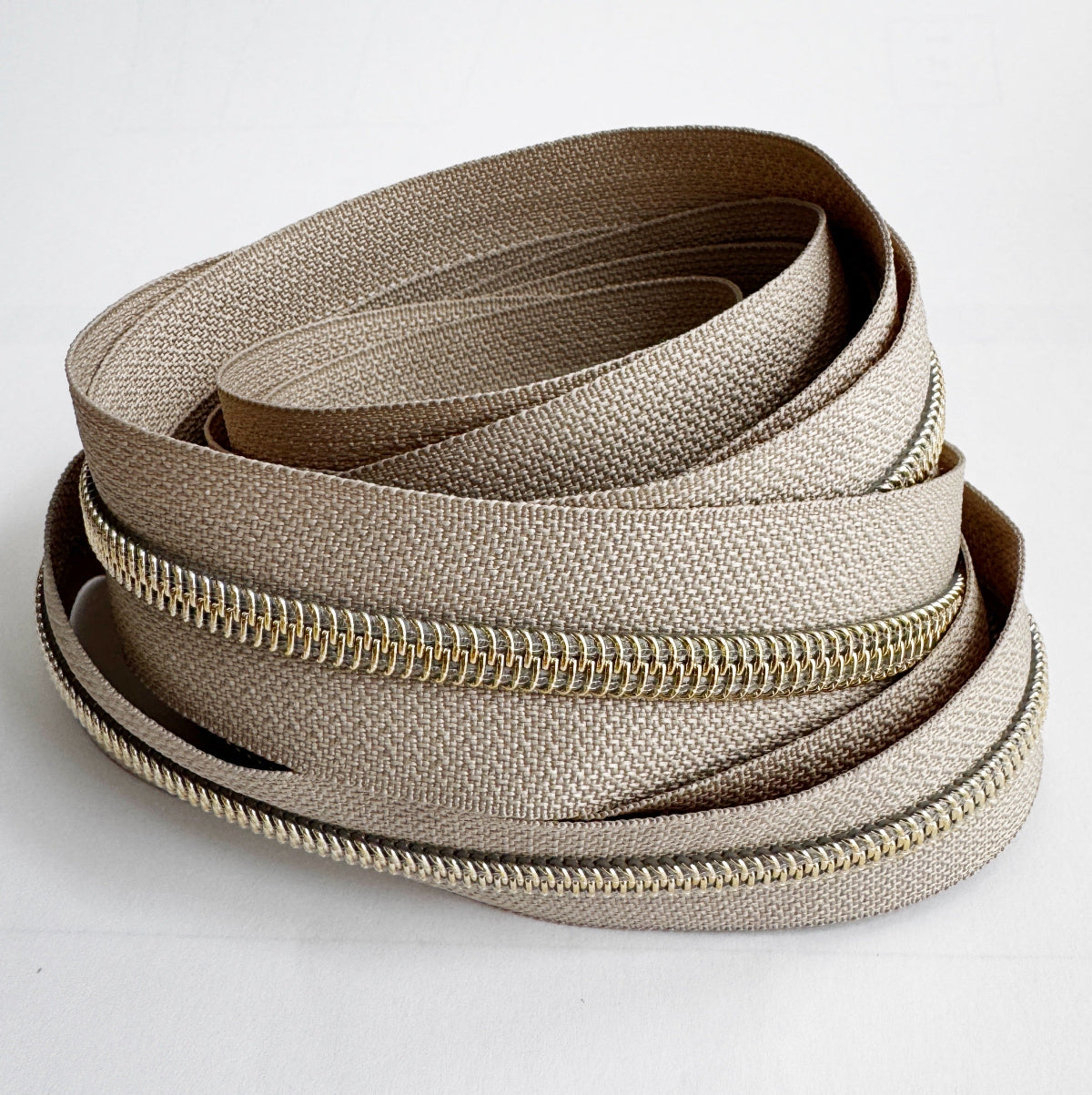 Beige zipper on a white background