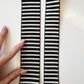 Black and white jacquard woven stripe webbing, 2-inch width, sold per yard. Strong decorative strap material for bag straps, purse handles, belts, and sewing projects.