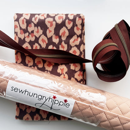 Blush quilted vinyl paired with coordinating blush and brown leopard print cotton fabric and Strawberry Mocha #5 continuous zipper tape with antique brass teeth, perfect for handbags, totes, backpacks, wallets, and sewing projects.