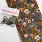 Brown floral cotton fabric with coordinating print and antique brass bag hardware for sewing handbags, crossbody bags, and handmade accessories.