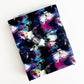 Folded Brushstroke Bonded Nylon fabric with an abstract paint splatter and cosmic paintbrush design in dark blue, pink, and neon accents.