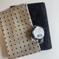 Sew Hungry Hippie Matchup 7 bundle including an abstract black bonded nylon pack, a yard of tan dotted fabric, and a black sewable leather strap