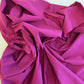 Close-up of purple fabric with folds