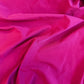 Close-up of bright pink fabric with folds