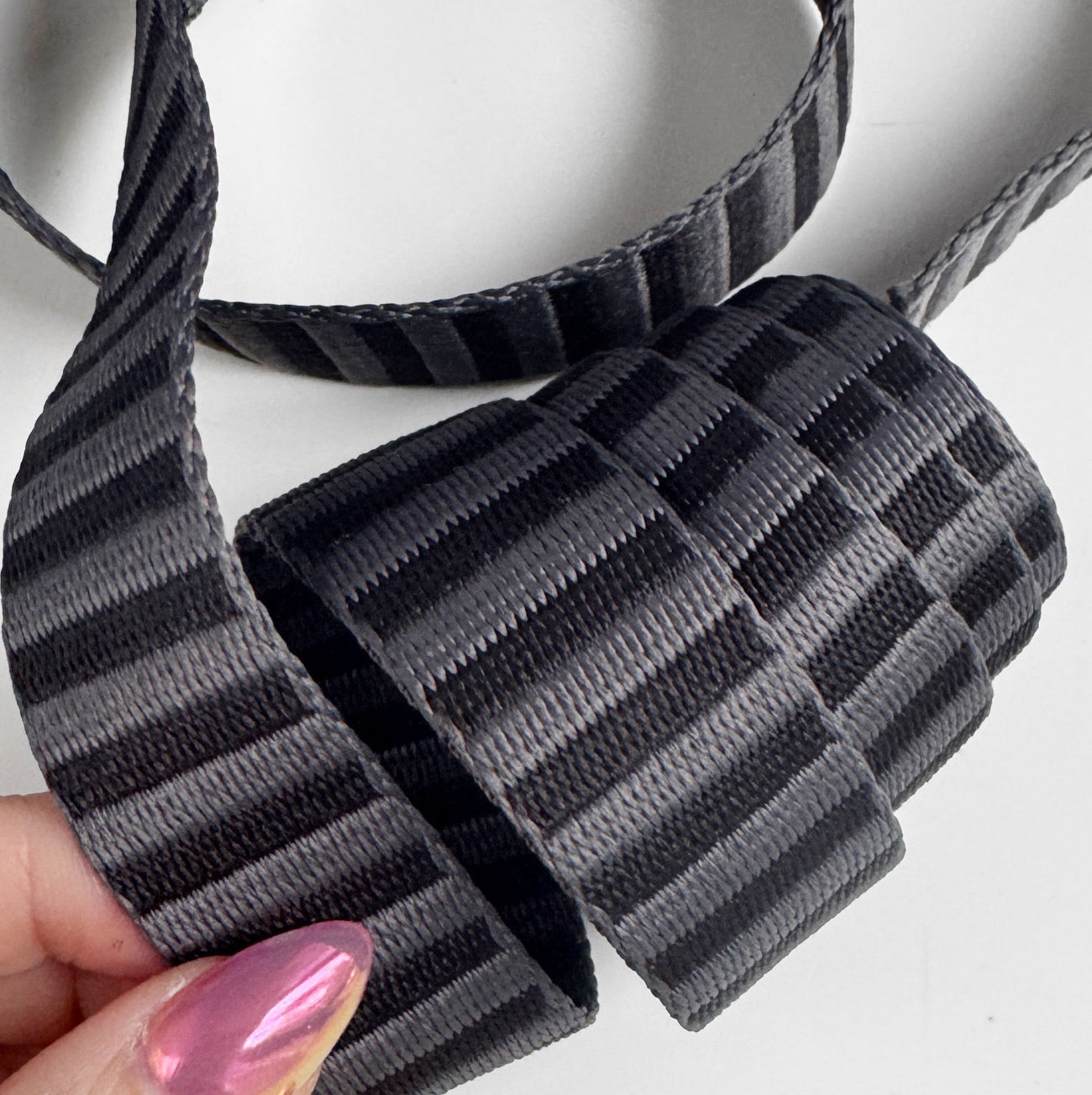 Premium charcoal grey woven jacquard bag strapping in a textured stripe pattern.