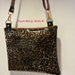 clear vinyl sling bag with leopard print design for fashion accessories