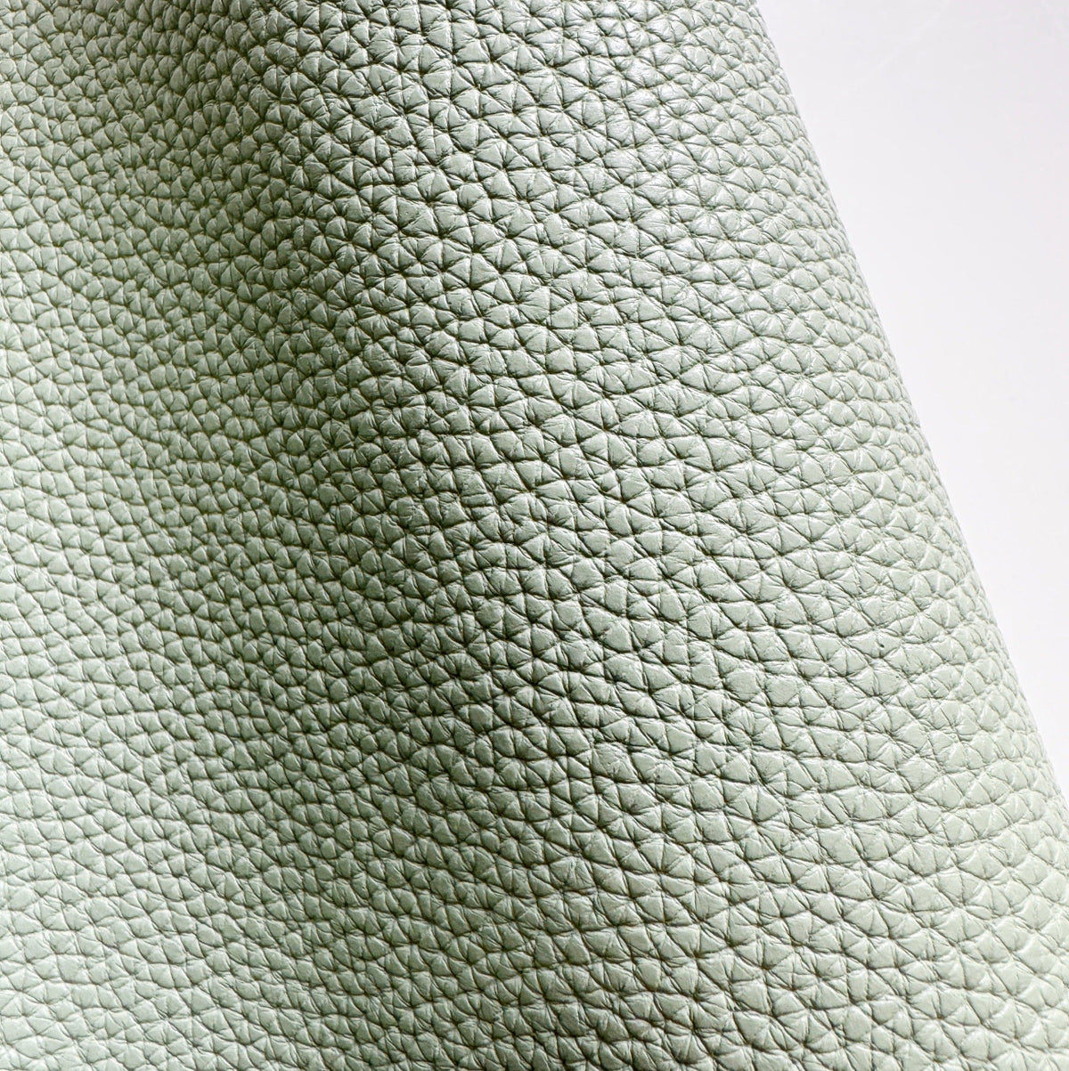 Moonglow New Sage pebbled vinyl faux leather fabric with distinctive grain texture