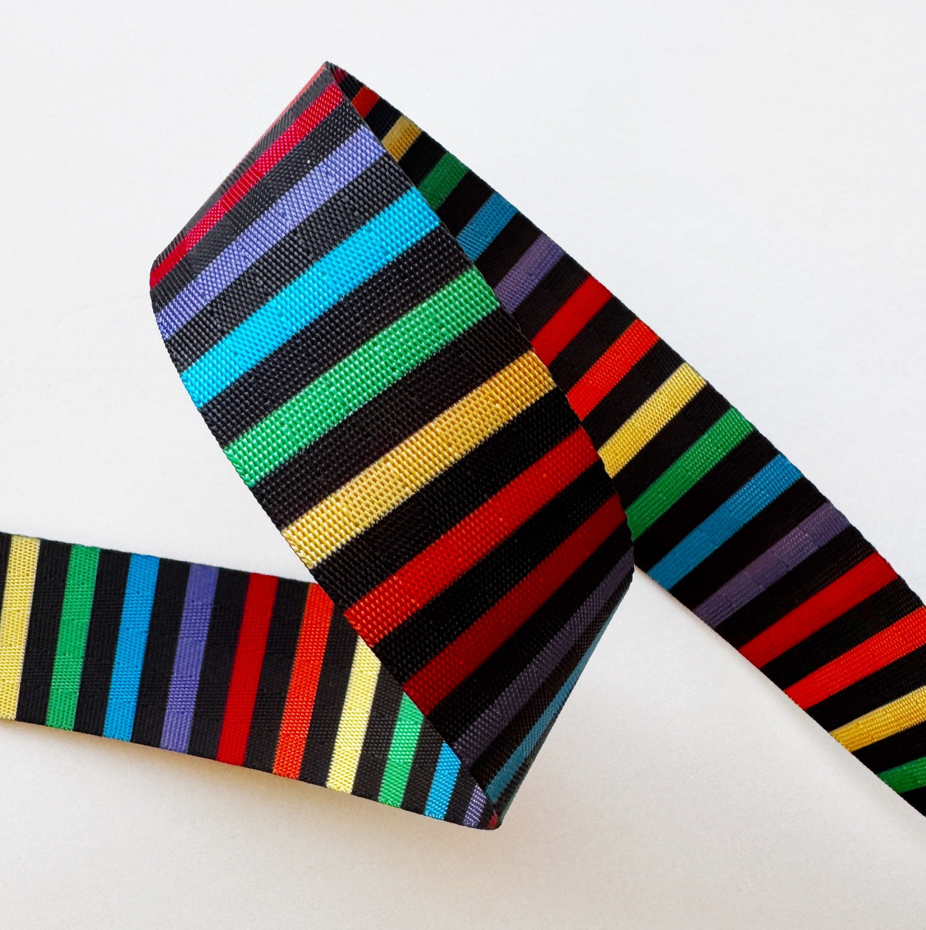 Colorful striped belt on a white background